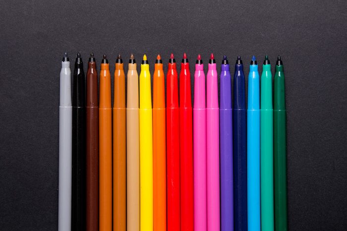 Set of multicolor felt-tip pens, markers on black background; colorful felt pens
