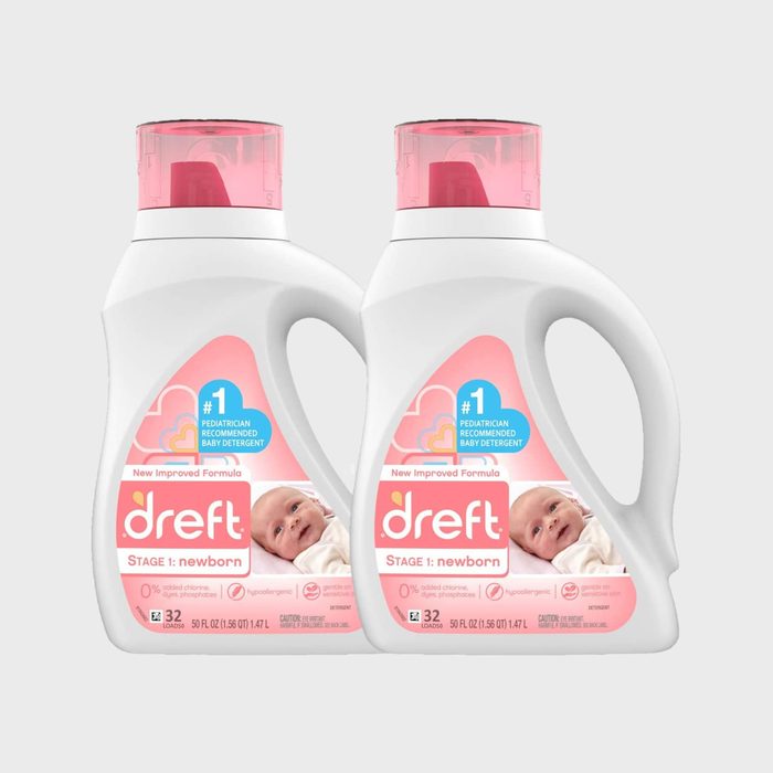 Two white bottles with pink caps containing Dreft Stage 1 newborn laundry detergent, featuring a baby image and claims of hypoallergenic and pediatrician recommendation.