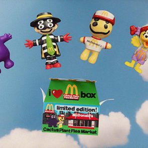 Figures float above a McDonald's box, each character with unique features, set against a sky with fluffy clouds.