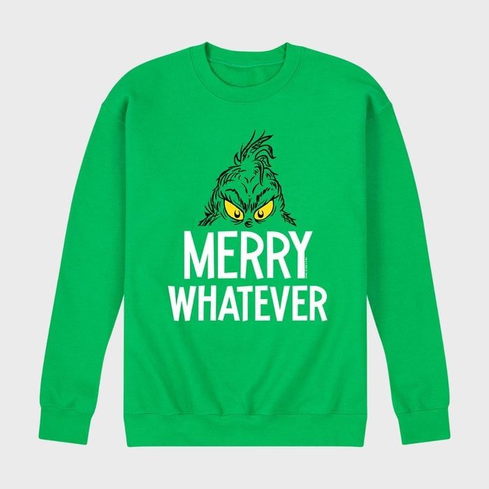 Green sweatshirt features cartoon face, text reads 