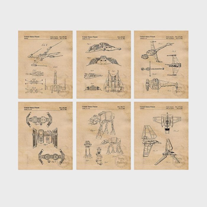 Blueprints showcase detailed spacecraft diagrams, arranged on vintage-style paper, labeled with 