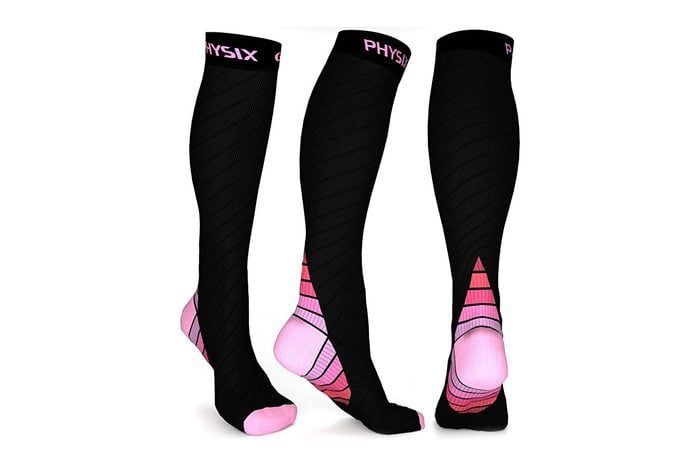 Black knee-high compression socks, featuring pink accents and 