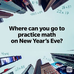 Question text overlays a cityscape of skyscrapers viewed from the ground. Math equations are scattered across the sky: 2Ã—5, 4Ã—4, 22Ã—17.
